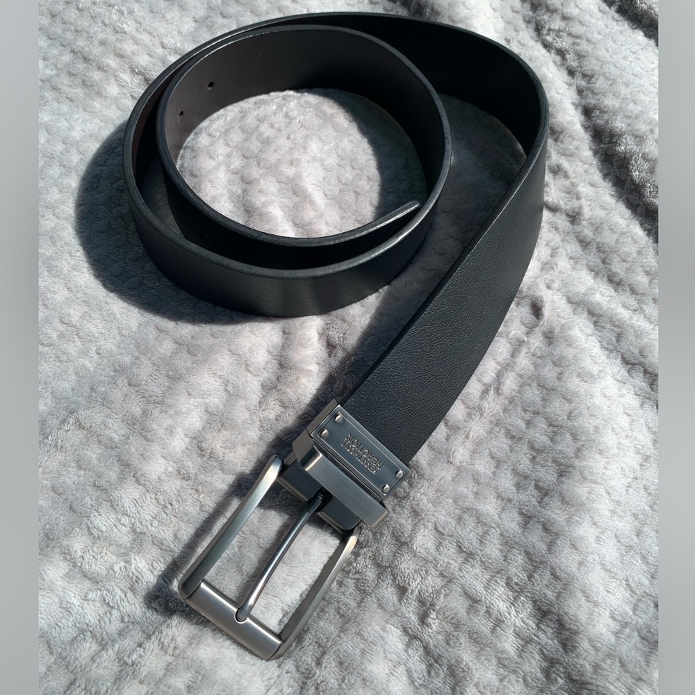 Never worn Kenneth Cole Reaction black leather men’s belt. Size 36.